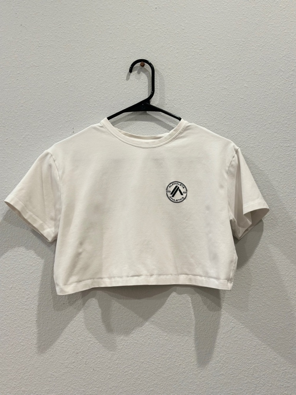 Alphalete White Crewneck Tee with Black Round Chest Emblem